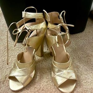 Gold strappy heels